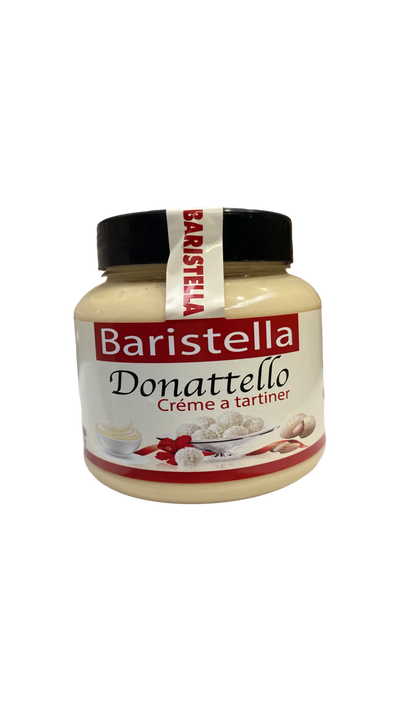Le Baristella Donattello de MIDI MINUIT (330 g) est doté dun couvercle noir et dune étiquette avec des noisettes crémeuses et un ruban rouge, promettant une saveur gourmande dans chaque tartinade.